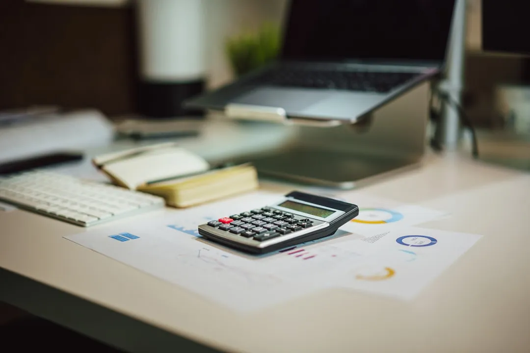tax documents desk, calculator paperwork